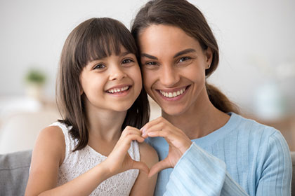 Mother holding daughter 